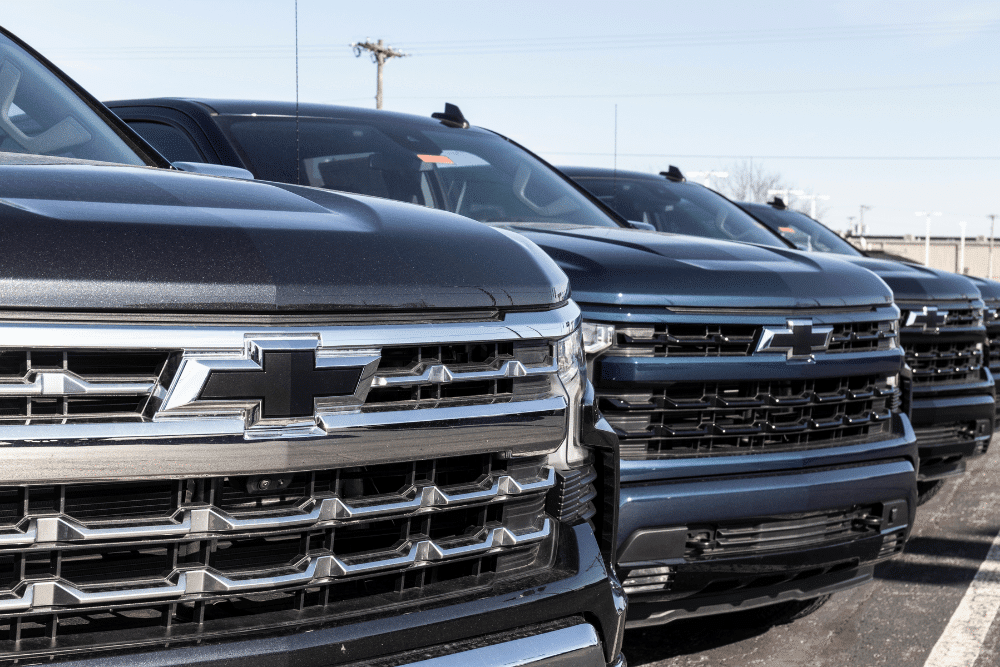 chevy repair, gmc repair, auto repair in Tea, SD at Sioux Empire Automotive Service Center. A row of Chevrolet pickup trucks parked in a lot.